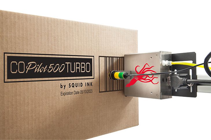The CoPilot 500 High-Resolution Printer printing a logo and barcode on a box